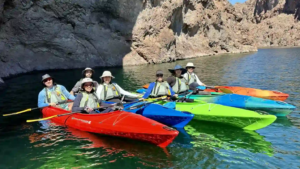 A group of people on kayaks